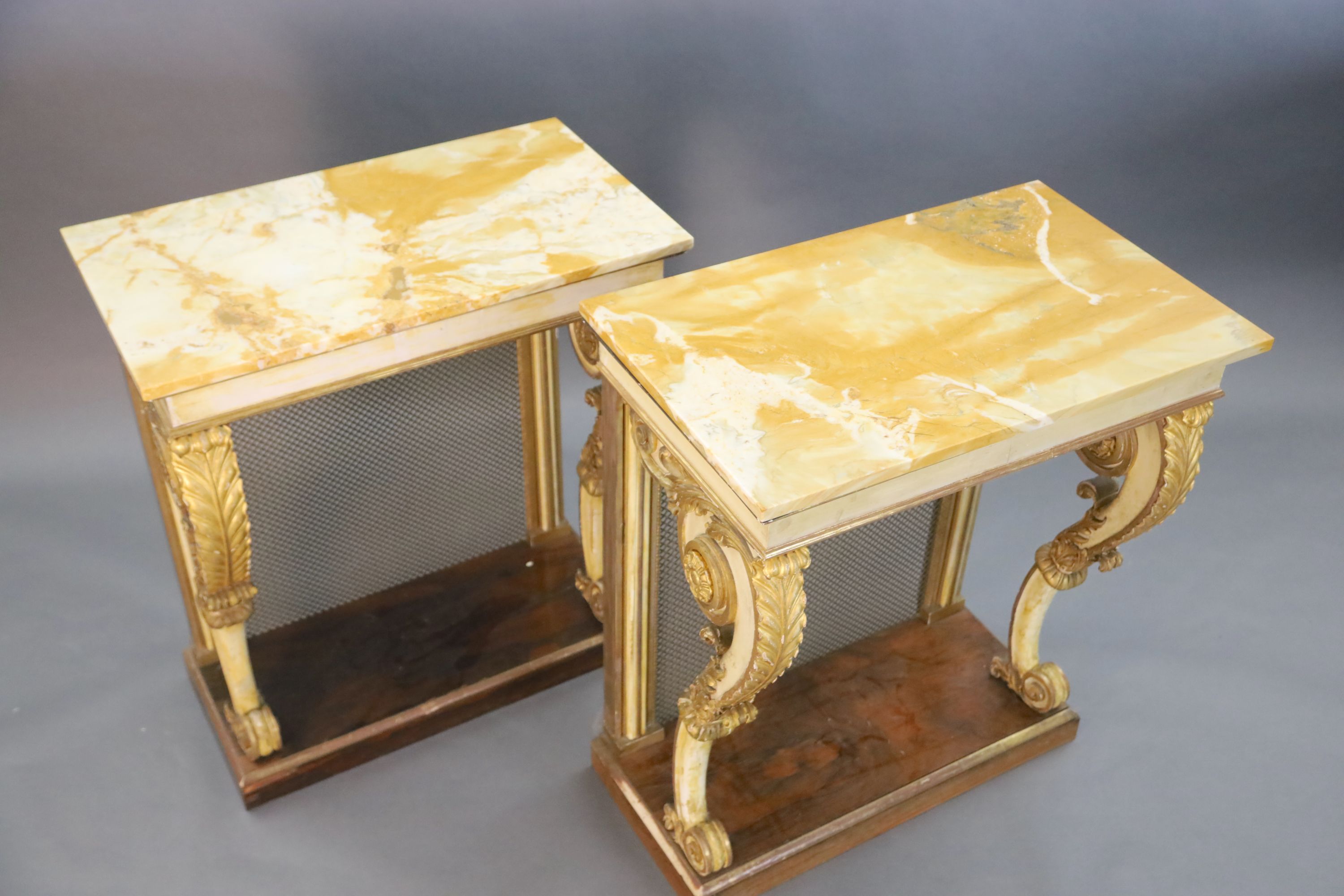 A pair of William IV parcel gilt cream painted and rosewood console tables, W.2ft 6in. D.1ft 6.5in. H.2ft 11.5in.